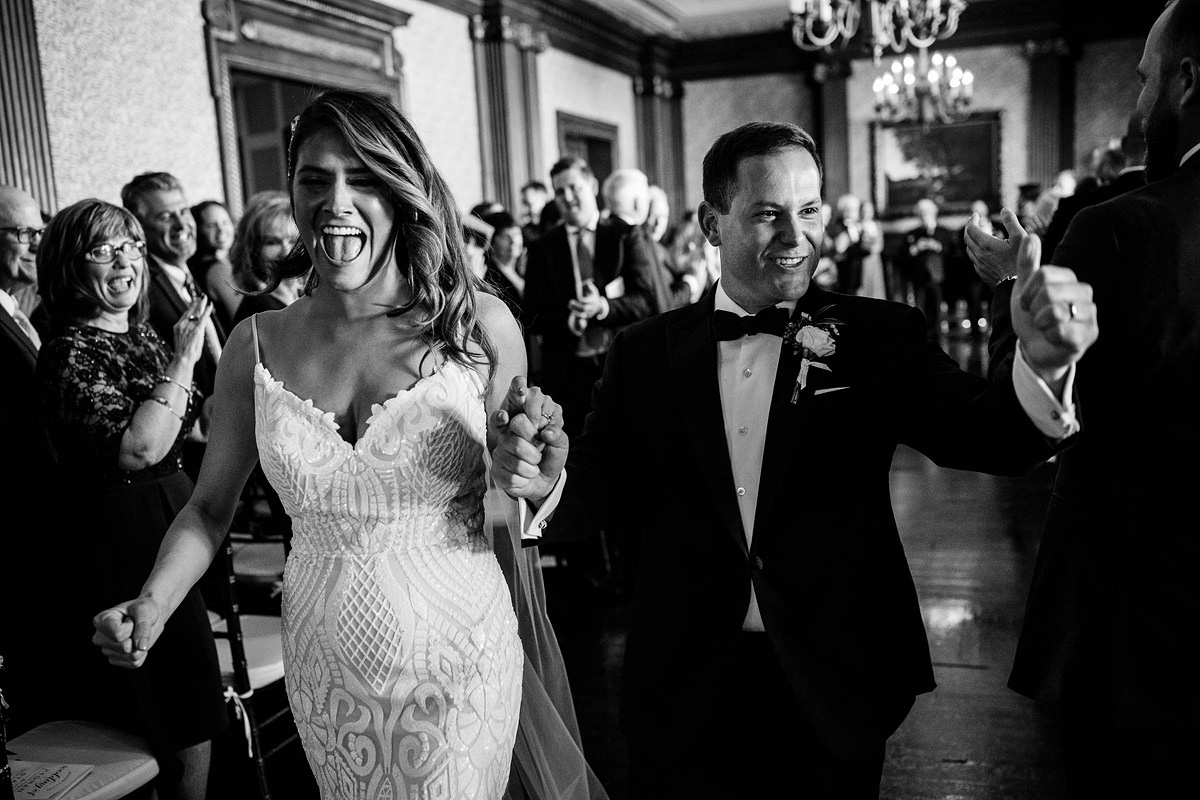 Bride and Groom Walking Down Aisle at University Club Wedding