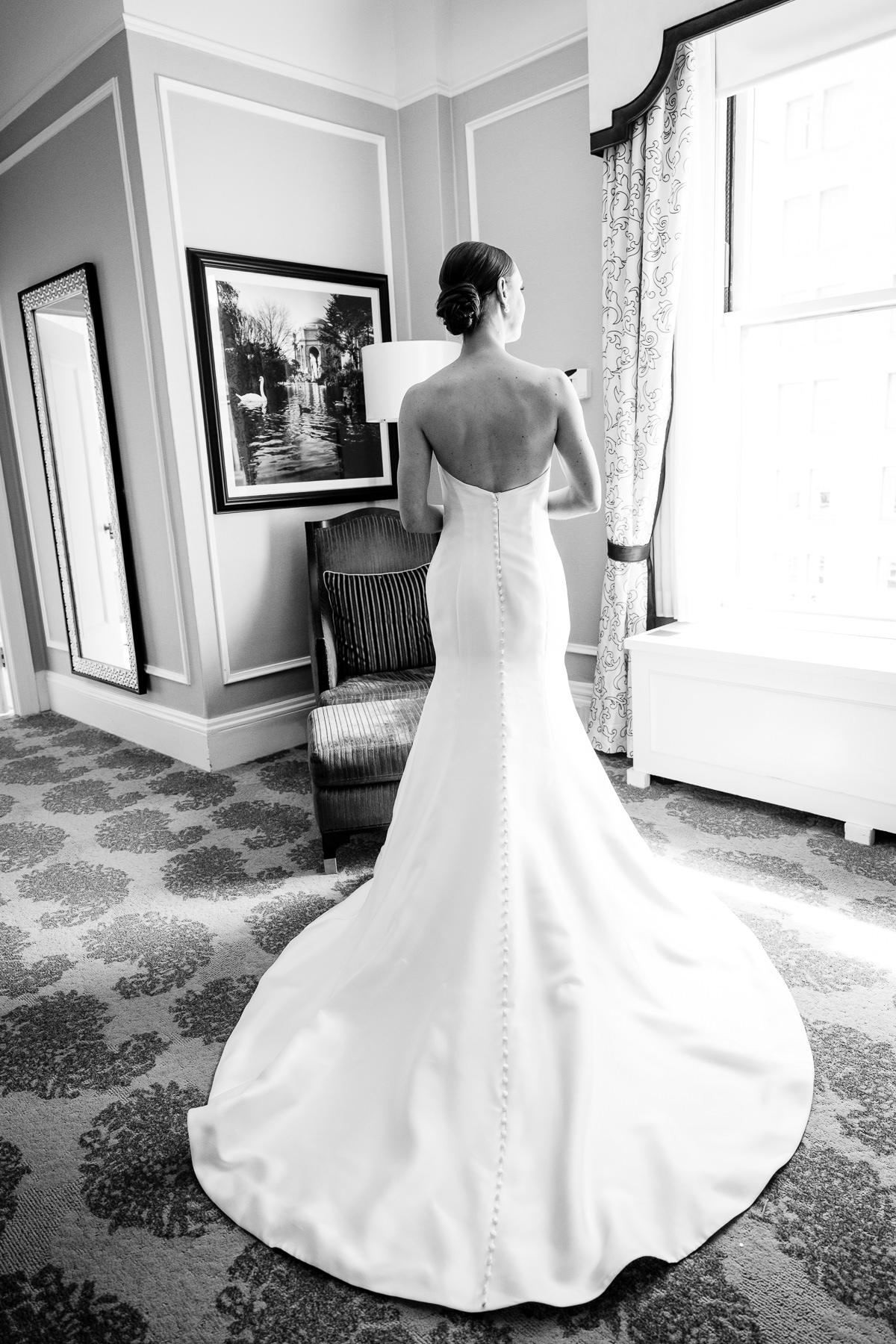 Bride looking out the window. Photo by San Francisco Wedding Photographer Duy Ho
