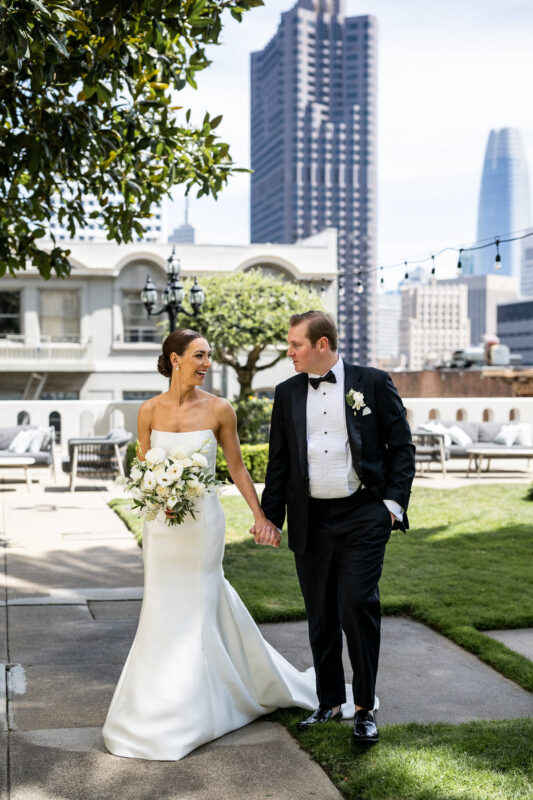 A couple walking on the rooftop garden at the Fairmont Hotel. Photo by San Francisco Wedding Photographer Duy Ho