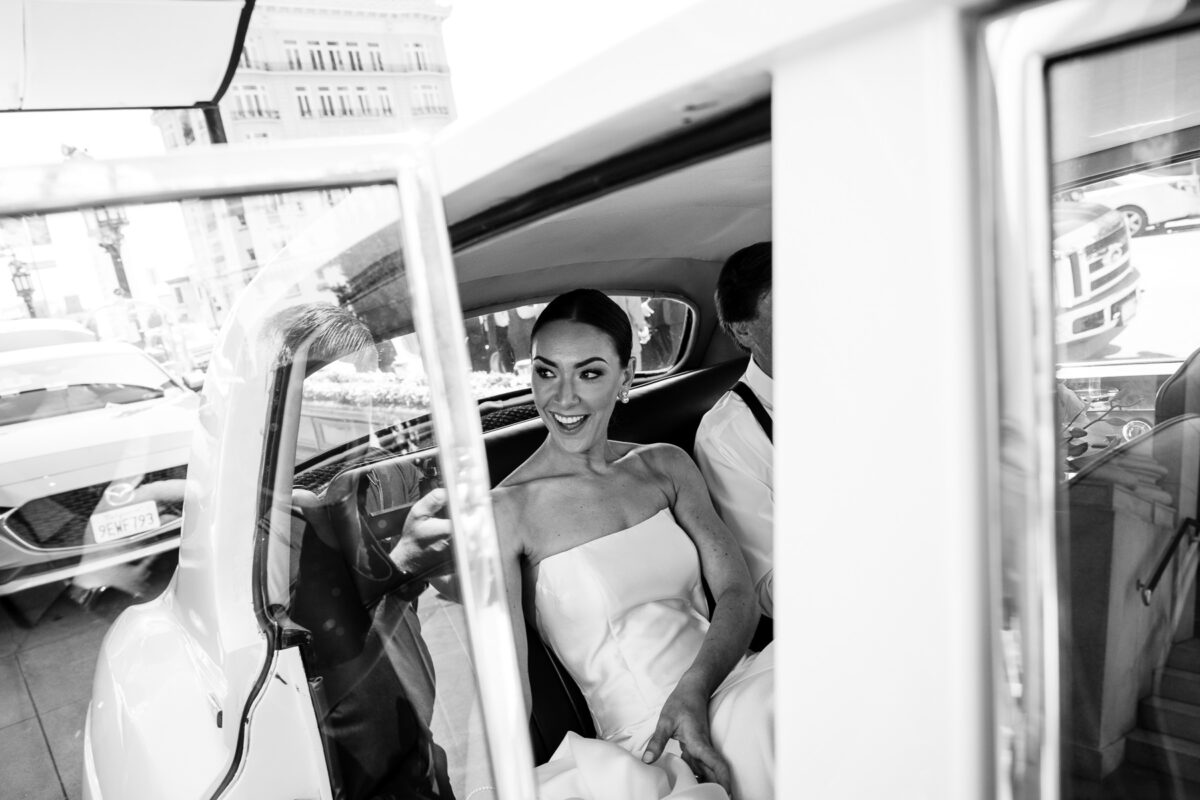 A bride in a classic car on her way to her wedding. Photo by San Francisco Wedding Photographer Duy Ho