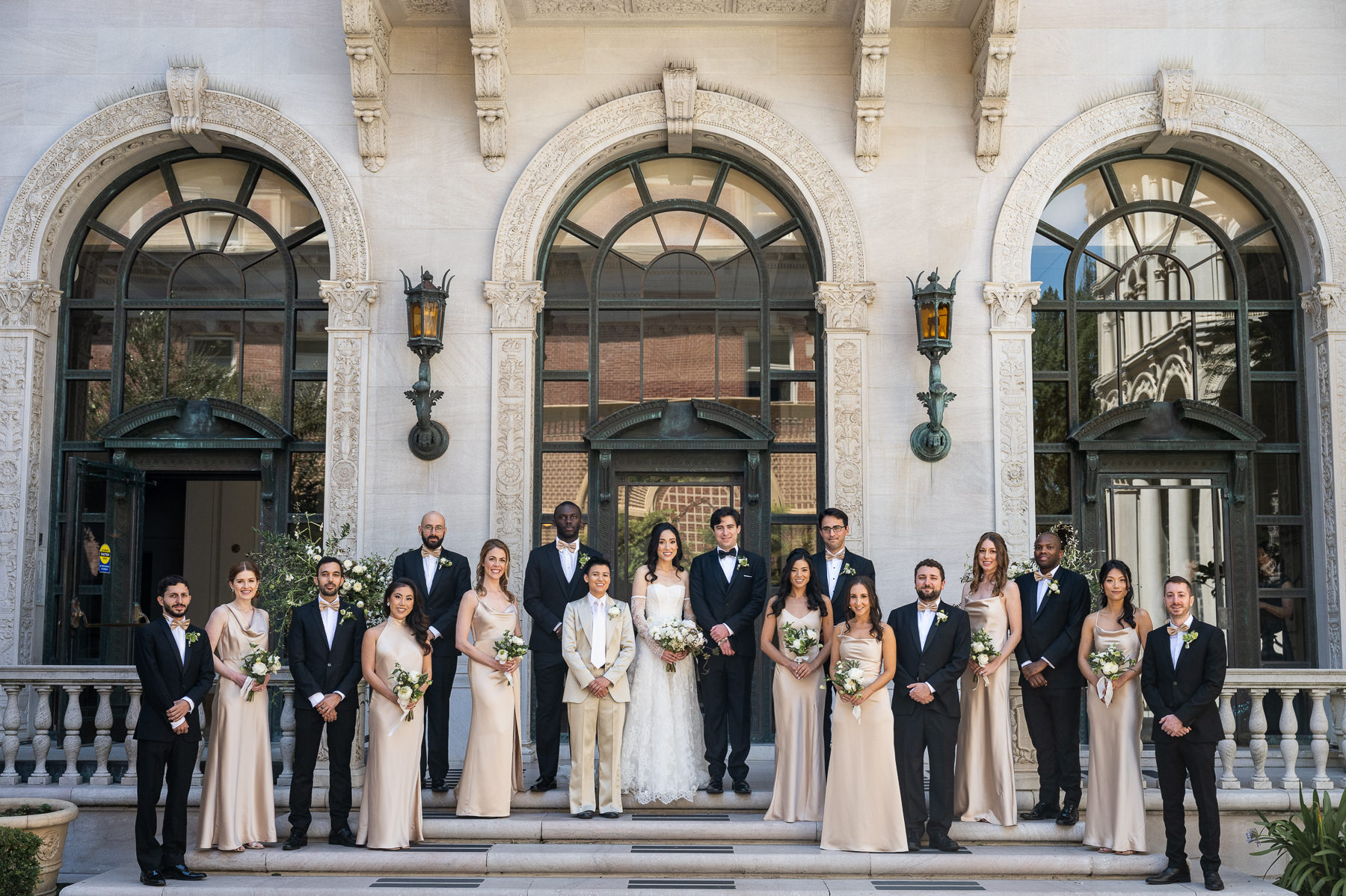 Wedding party portrait in front of Flood Mansion exterior, San Francisco mansion wedding photographer Duy Ho