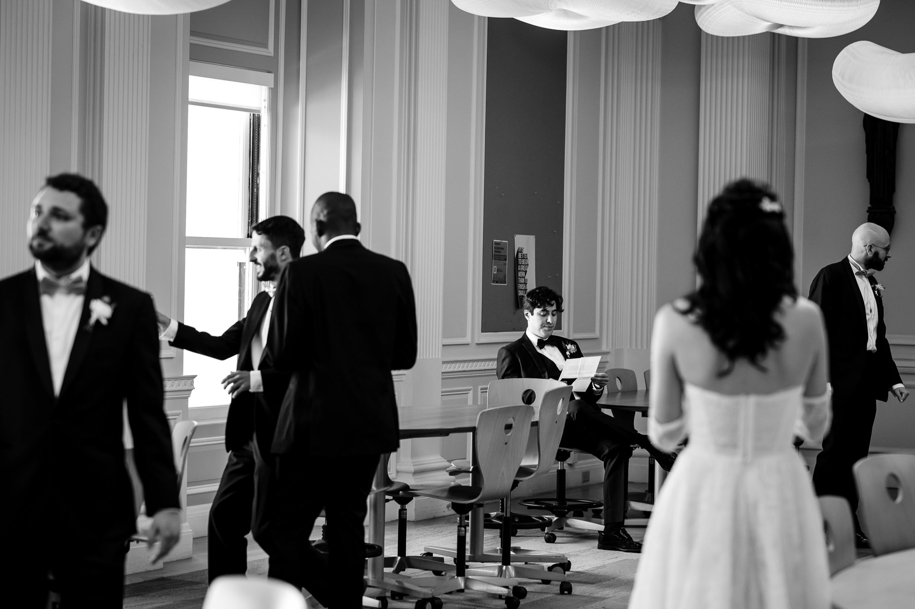 Bride walking down the aisle with father in Flood Mansion Grand Hall, guests standing along gold chiavari chairs