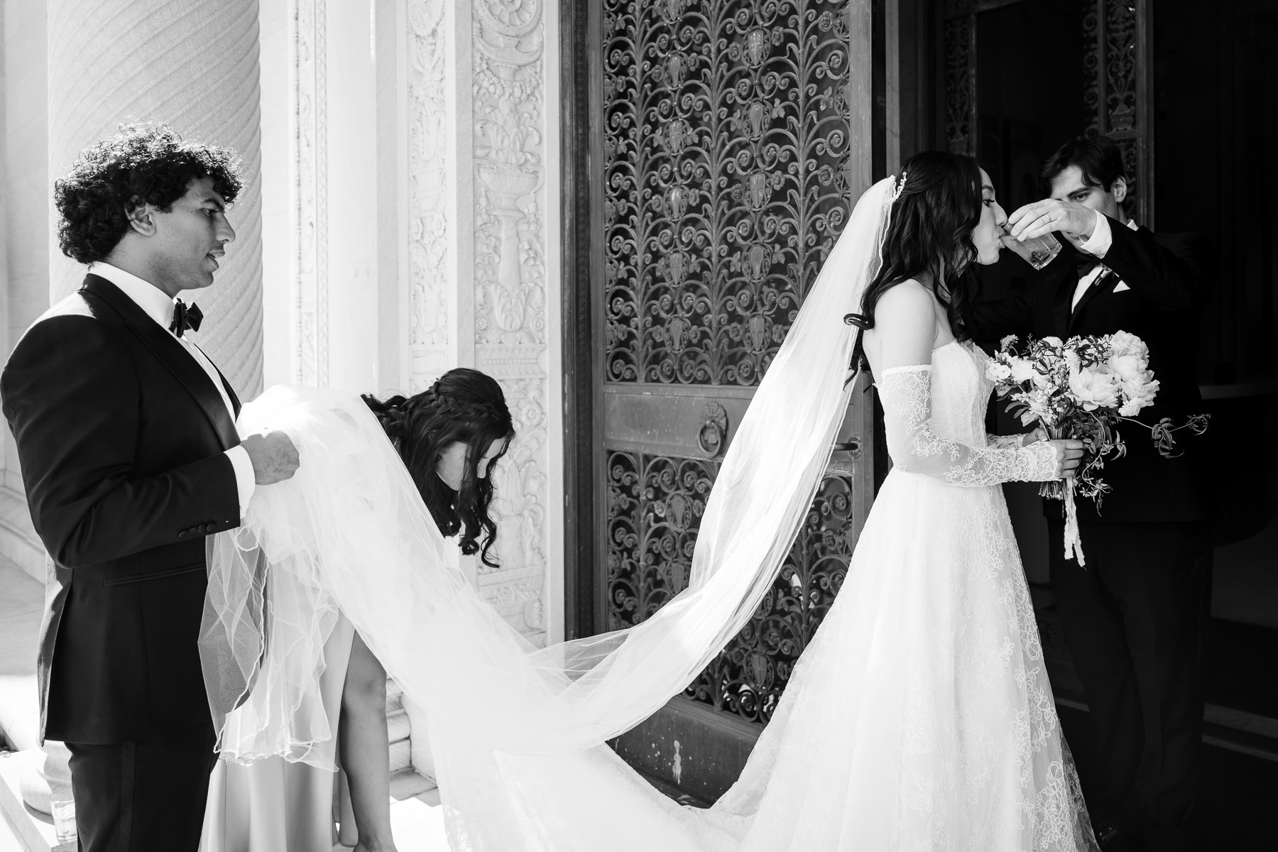 Close-up of bride laughing and groom smiling together outside Flood Mansion, San Francisco wedding portrait
