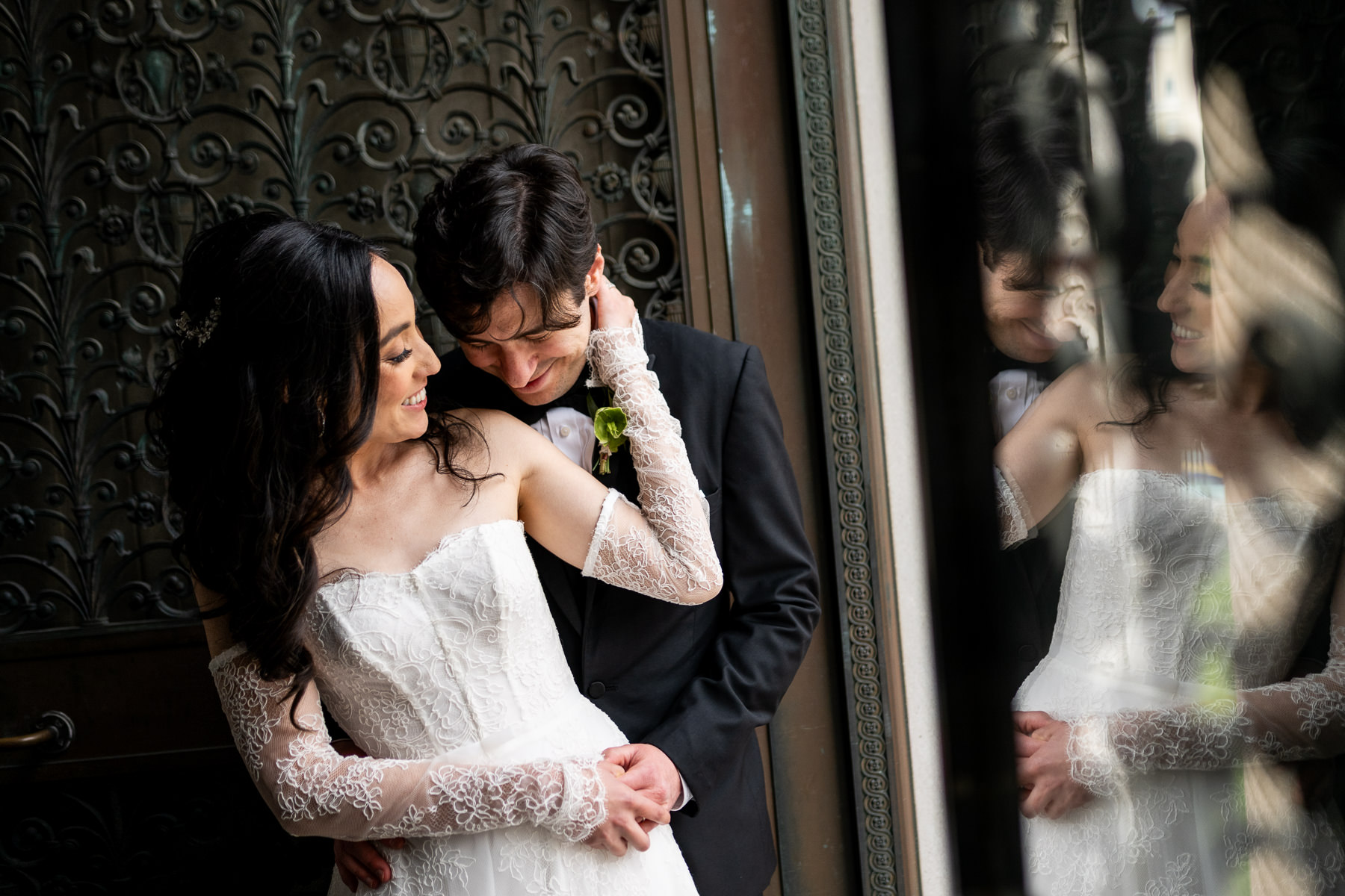 Couple portrait at ornate iron door of Flood Mansion exterior, San Francisco wedding photographer Duy Ho