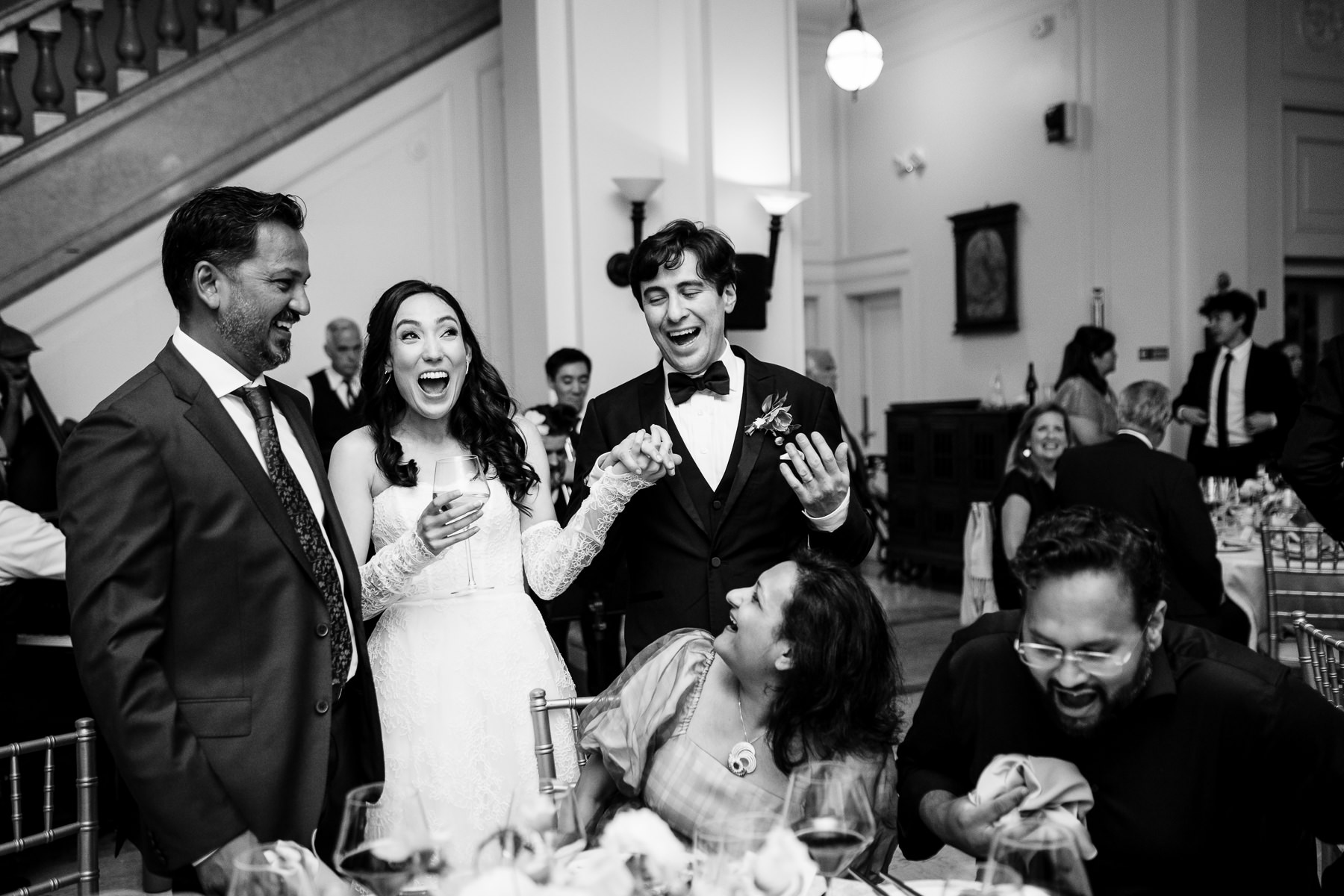 First dance wide shot — couple dancing in Flood Mansion Grand Hall bay window alcove with guests watching, San Francisco